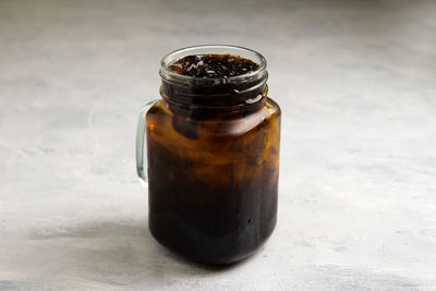 Close-up of glass jar on table