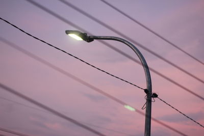 Low angle view of street light against sky