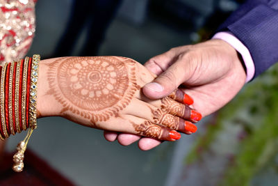 Close-up of woman holding hands