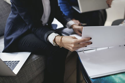 Businesswoman with documents in home office