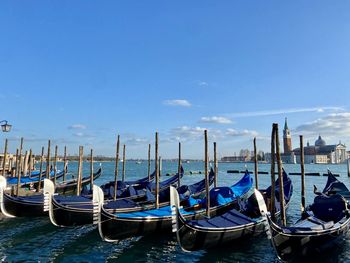 Boats in sea against sky