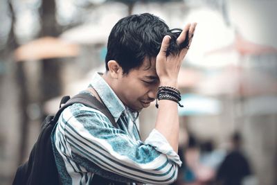 Side view of young man looking away