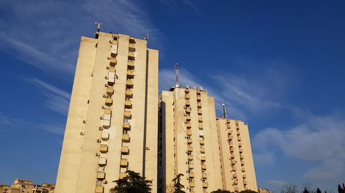 Low angle view of building against blue sky