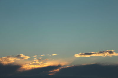 Low angle view of cloudy sky at sunset