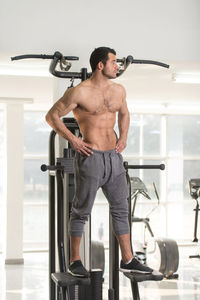 Muscular man exercising in gym