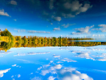 Scenic view of lake against blue sky