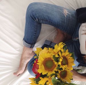 Close-up of woman holding flowers