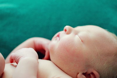 Close-up of young woman lying down