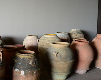 Pots by wall at workshop