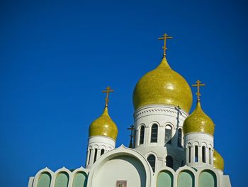 Low angle view of holy virgin cathedral against clear blue sky