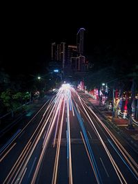 High angle view of light trails on road at night