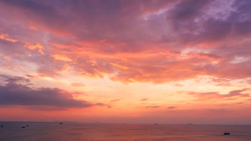 Aerial seascape view and small containers ship sailing in sea