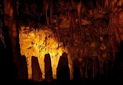 Low angle view of illuminated cave