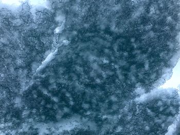 Close-up of snow against sky