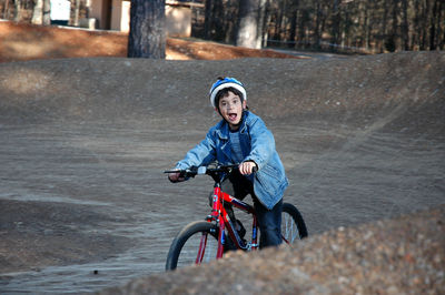 Portrait of boy riding bicycle