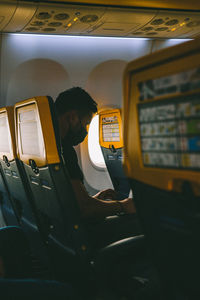 Passenger on the airplane on the seat. 