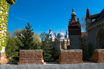 View of buildings against blue sky