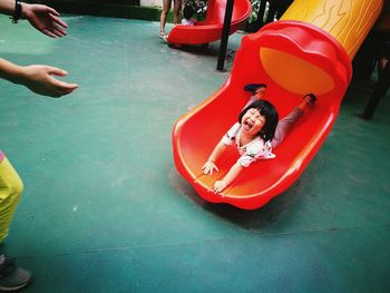 High angle view of girl playing in play equipment at park