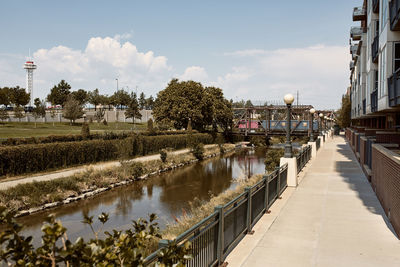 Various steel pedestrian bridges along pathway of cherry creek trail in downtown denver, colorado 