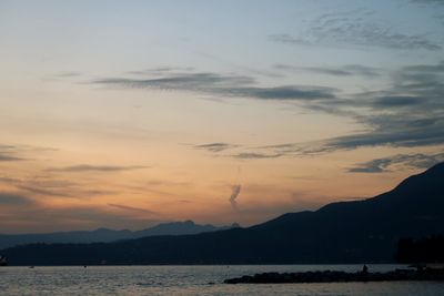 Scenic view of silhouette mountains against sky during sunset