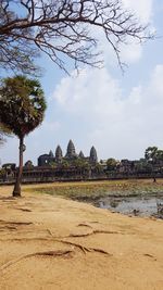 View of temple against cloudy sky