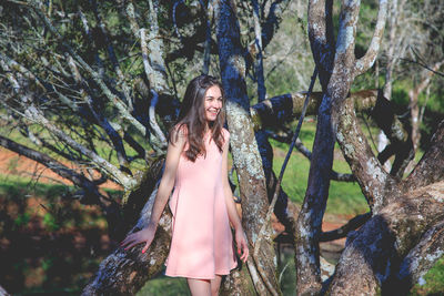 Portrait of young woman in forest