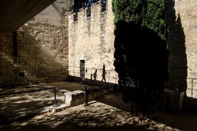 Abandoned building by wall