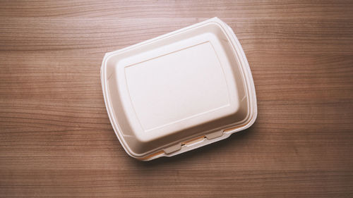 Directly above shot of empty plate on wooden table