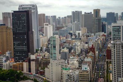 High angle view of buildings in city against sky