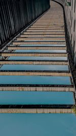 High angle view of steps by swimming pool