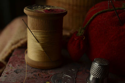 Close-up of thread spool on table