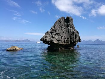 Scenic view of sea against blue sky