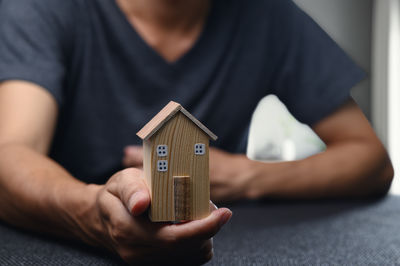 Midsection of man using phone