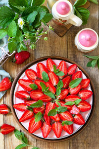 High angle view of red berries on table