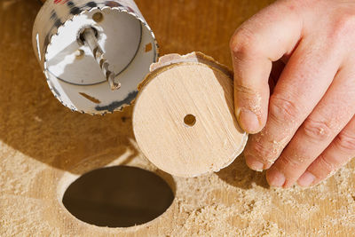 Cropped hand of person preparing food