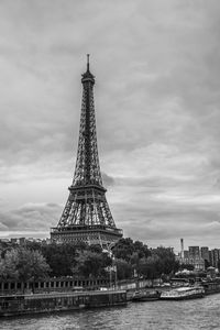 Low angle view of tower against cloudy sky