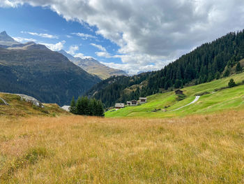 Scenic view of landscape and mountains against sky