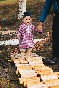 Low angle view of friends standing by tree