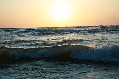 Scenic view of sea against clear sky during sunset