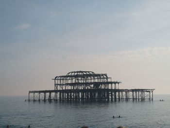 Pier on sea against sky