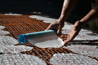 Midsection of person preparing food