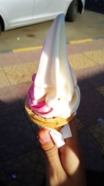 Midsection of woman holding ice cream