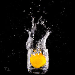 Close-up of splashing water against black background