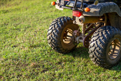 Close-up of car on field atv