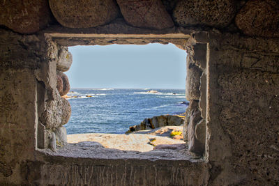 View of sea through window