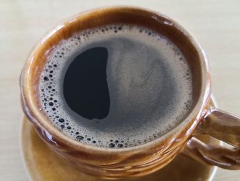 High angle view of coffee cup on table