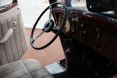 Close-up of vintage car steering wheel and interior
