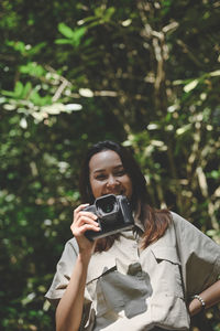 Series photo of young woman photographer with her camera shooting photo outdoor