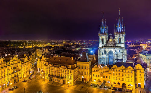 High angle view of illuminated buildings in city at night