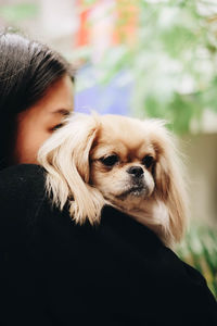 Close-up of woman with dog 